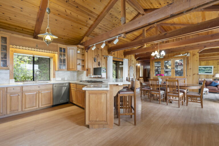 A kitchen in a log cabin.
